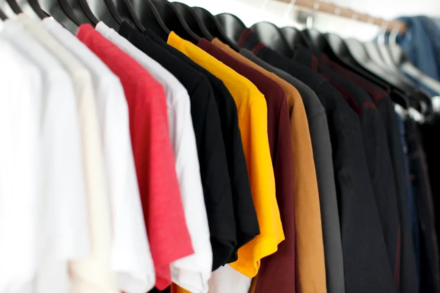 Folded apparel and fabric swatches on a table